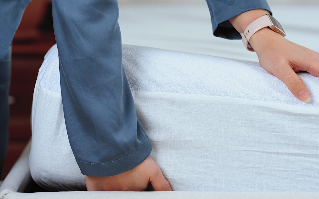 Woman checking for material that bed bugs do not like in Denver, CO